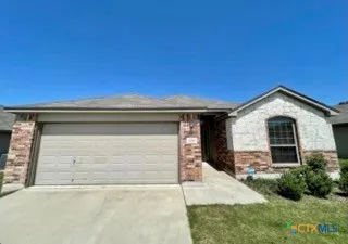 a front view of a house with garage