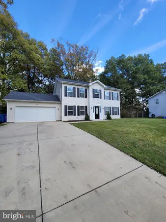 a house view with a garden space