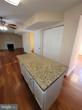 a living room with hard wood flooring