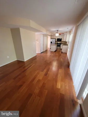 a view of living room with furniture and a window
