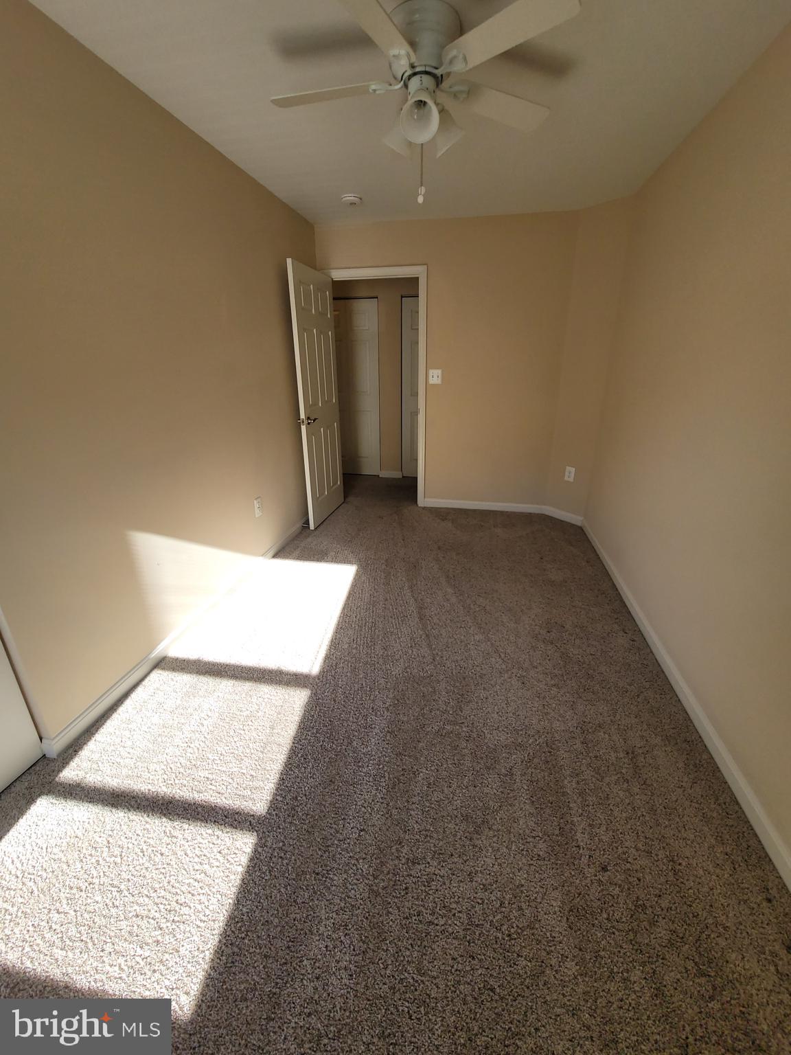 141 Jefferson Road Waldorf, MD 20602 - Photo 27 of 37 an empty room with a ceiling fan and window