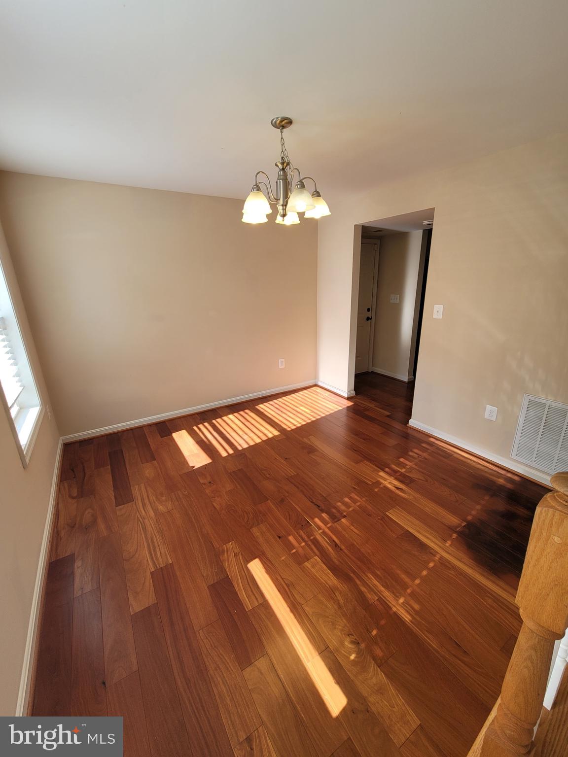 141 Jefferson Road Waldorf, MD 20602 - Photo 6 of 37 a view of an empty room with wooden floor and a window