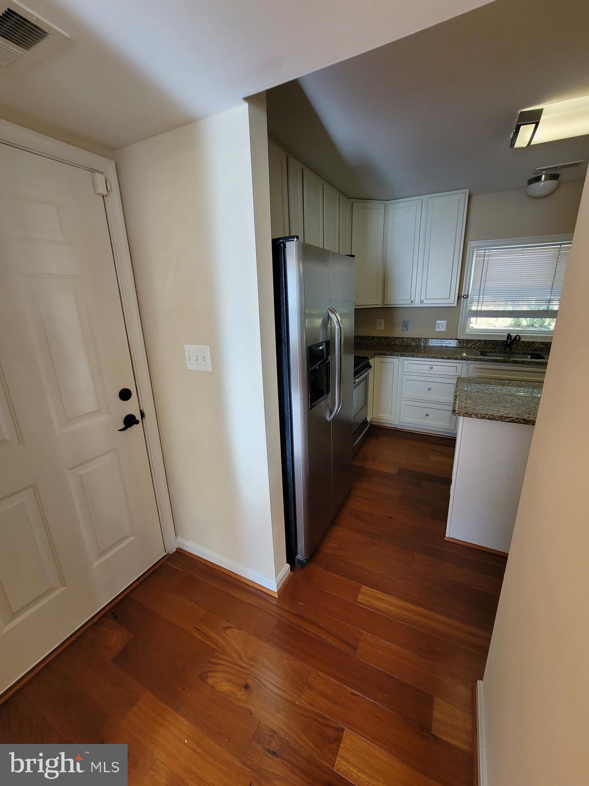 141 Jefferson Road Waldorf, MD 20602 - Photo 8 of 37 a kitchen with stainless steel appliances a refrigerator and wooden floor