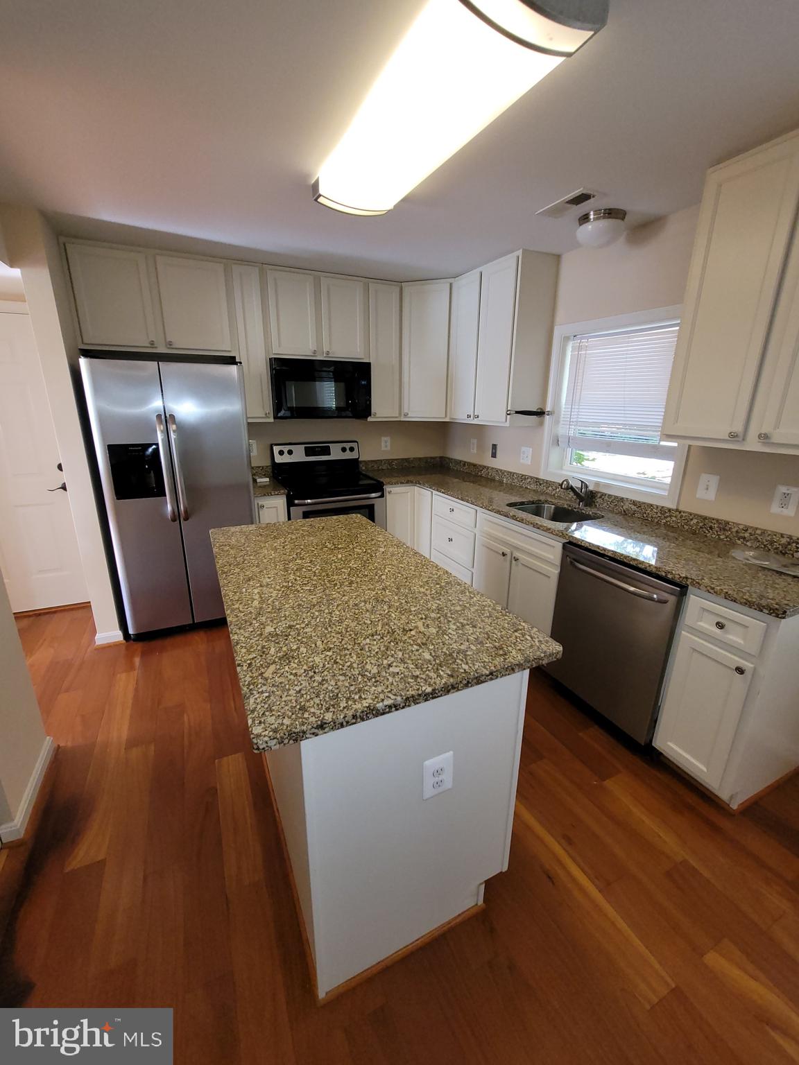 141 Jefferson Road Waldorf, MD 20602 - Photo 10 of 37 a kitchen with stainless steel appliances granite countertop a sink a stove and a refrigerator