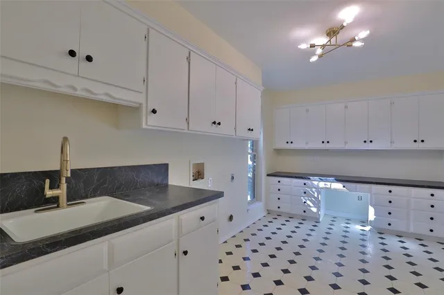a bathroom with double sink and a mirror