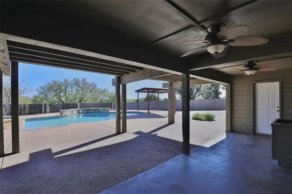 an aerial view of a house with yard swimming pool and outdoor seating