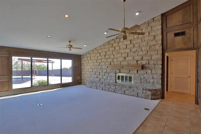 a very nice looking room with a ceiling fan