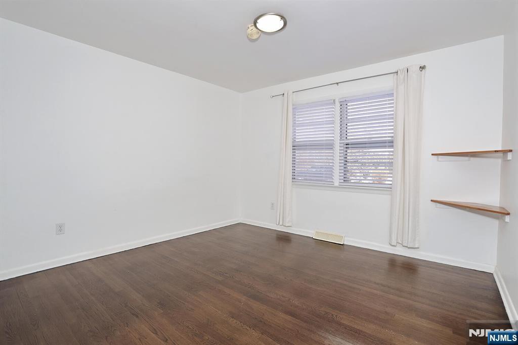 31 Madison Avenue Demarest, NJ 07627 - Photo 11 of 29 an empty room with wooden floor and windows