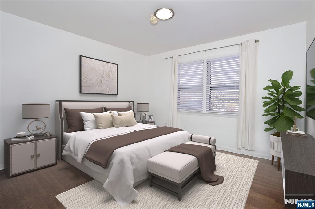 31 Madison Avenue Demarest, NJ 07627 - Photo 12 of 29 a bedroom with a bed and a potted plant