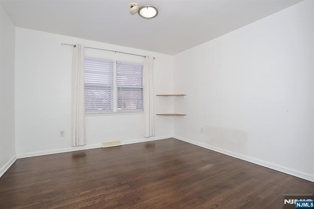 31 Madison Avenue Demarest, NJ 07627 - Photo 13 of 29 an empty room with wooden floor and windows