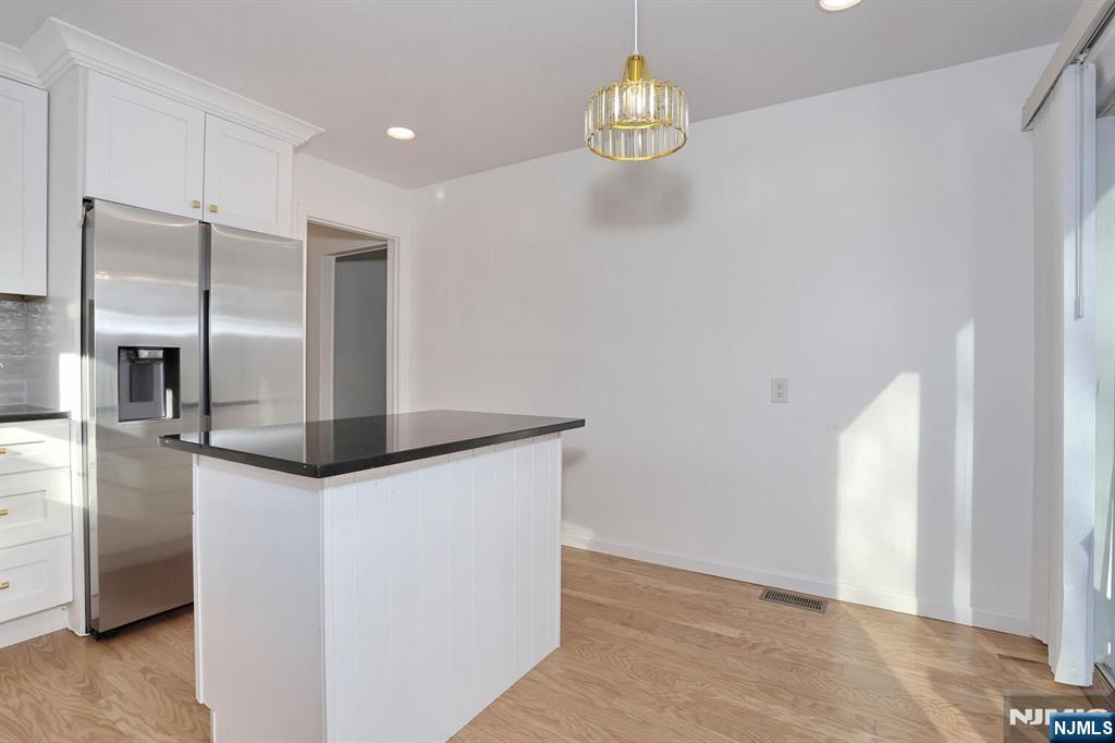 31 Madison Avenue Demarest, NJ 07627 - Photo 13 of 50 a kitchen with stainless steel appliances a refrigerator and microwave