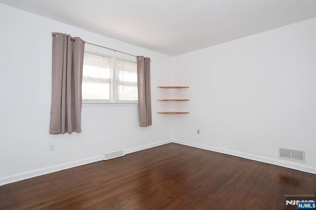 31 Madison Avenue Demarest, NJ 07627 - Photo 16 of 50 an empty room with wooden floor and windows