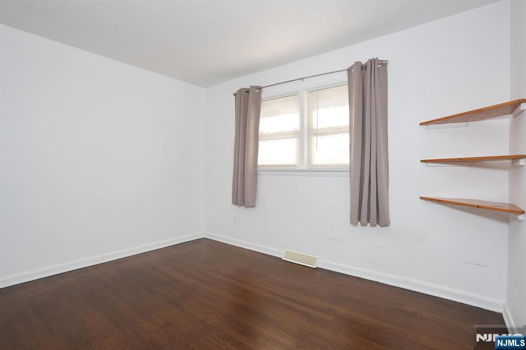 31 Madison Avenue Demarest, NJ 07627 - Photo 18 of 50 an empty room with wooden floor and windows