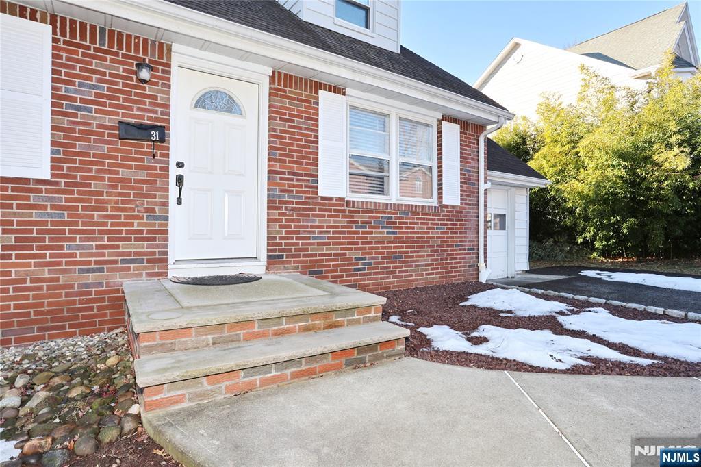 31 Madison Avenue Demarest, NJ 07627 - Photo 2 of 29 a front view of a house