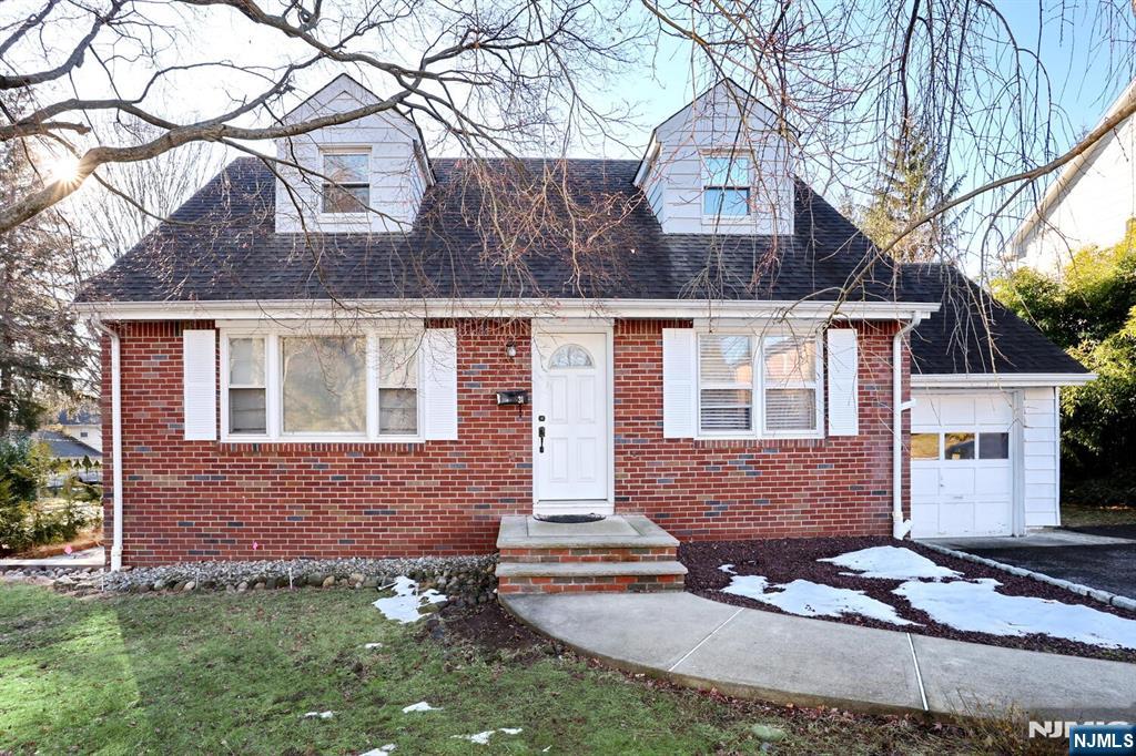 31 Madison Avenue Demarest, NJ 07627 - Photo 2 of 50 a front view of a house with garden