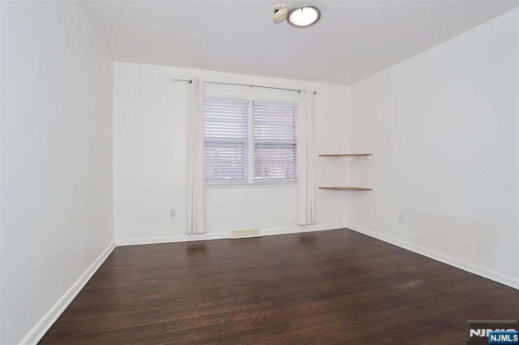 31 Madison Avenue Demarest, NJ 07627 - Photo 22 of 50 an empty room with wooden floor and windows