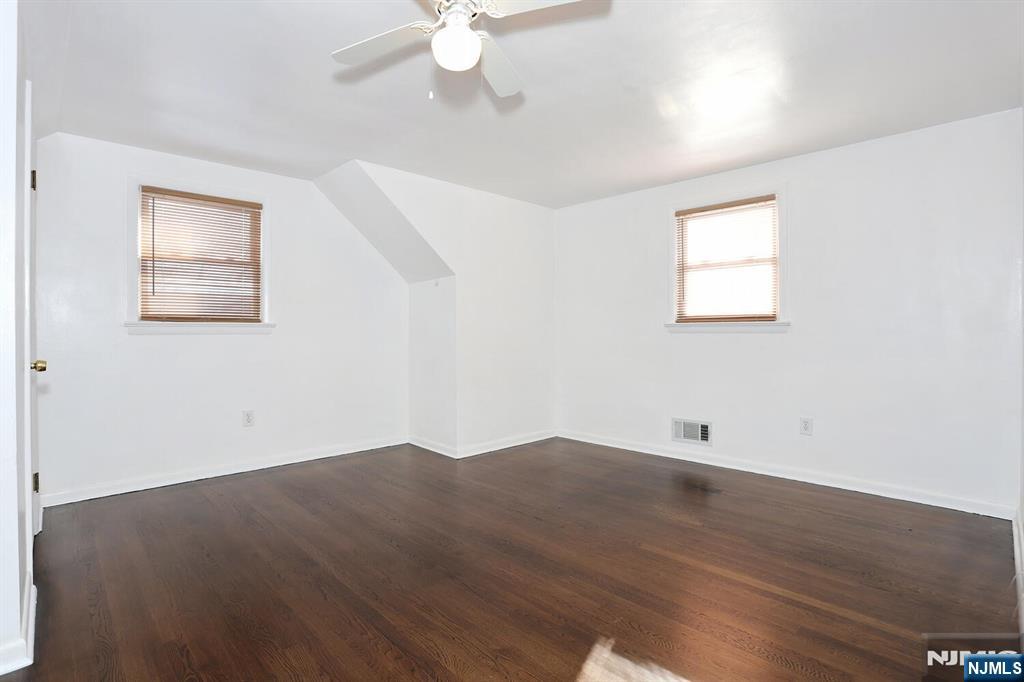 31 Madison Avenue Demarest, NJ 07627 - Photo 30 of 50 an empty room with wooden floor and windows