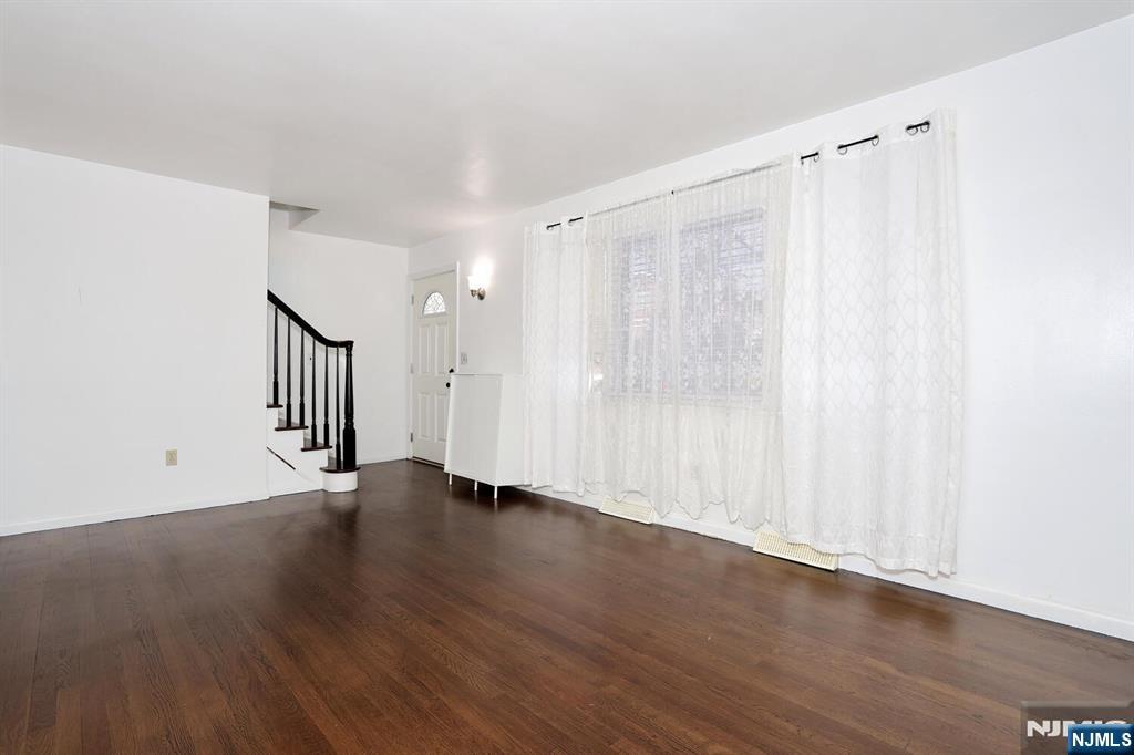 31 Madison Avenue Demarest, NJ 07627 - Photo 5 of 50 a view of an empty room with wooden floor and a window
