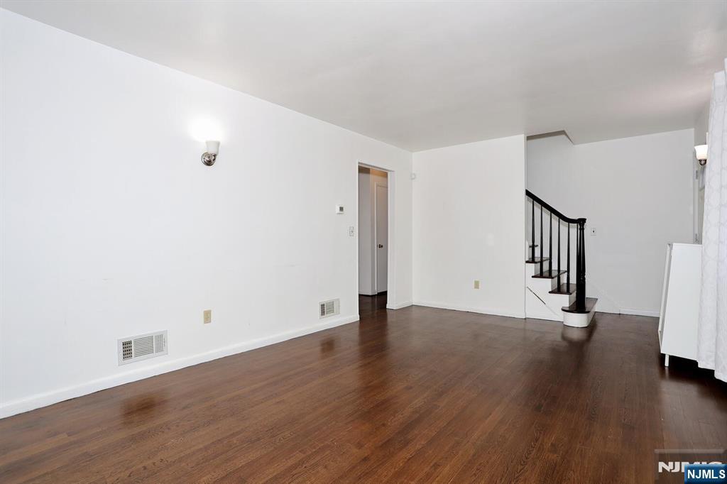 31 Madison Avenue Demarest, NJ 07627 - Photo 6 of 29 a view of an empty room with wooden floor and a window
