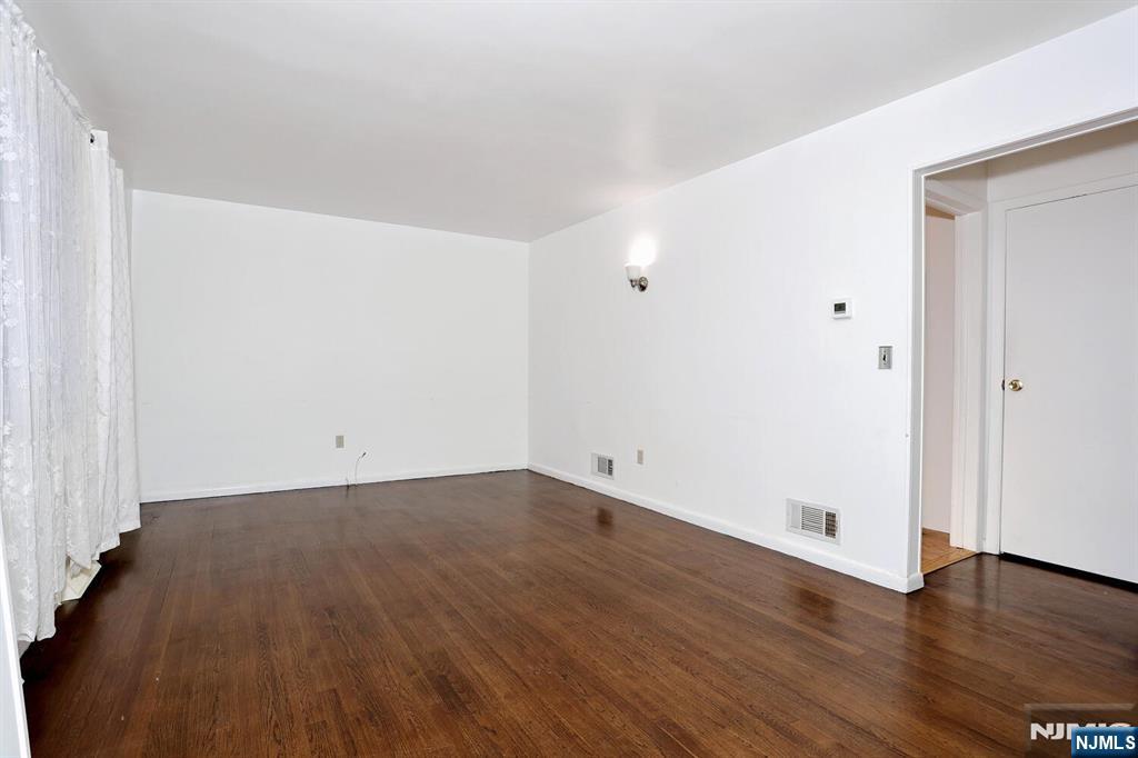 31 Madison Avenue Demarest, NJ 07627 - Photo 7 of 50 an empty room with wooden floor