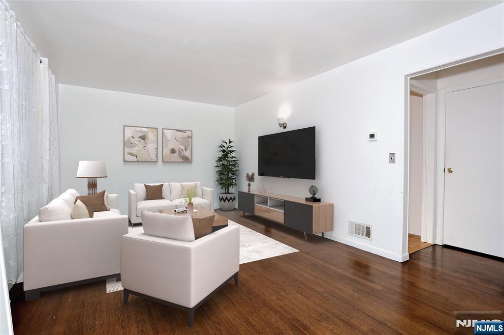 31 Madison Avenue Demarest, NJ 07627 - Photo 8 of 50 a living room with furniture and a flat screen tv