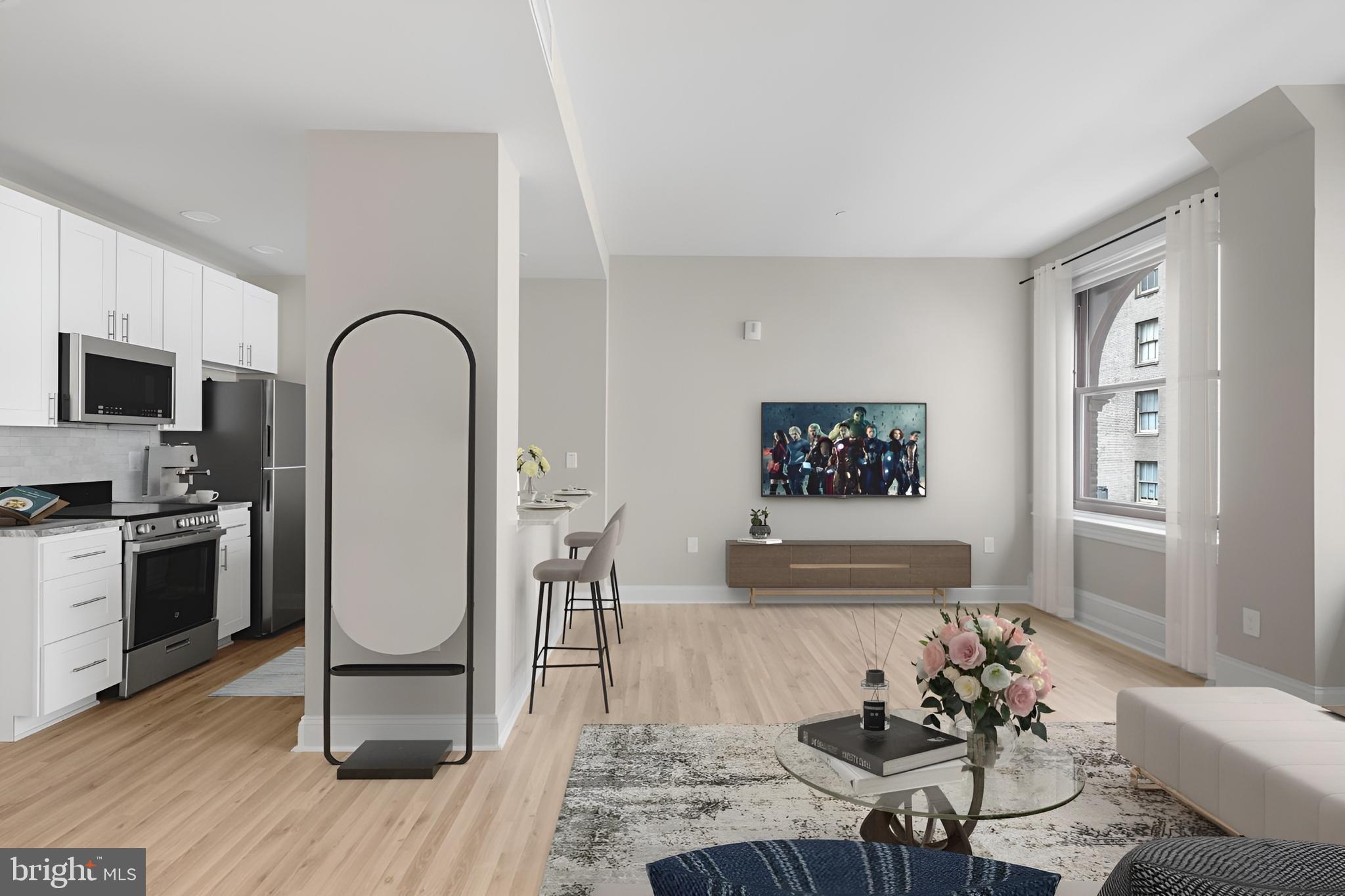 1420-22 Chestnut Street, Unit 604 Philadelphia, PA 19102 - Photo 9 of 35 a living room with furniture and a wooden floor