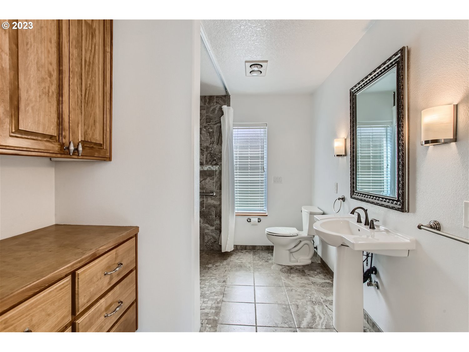 5585 Southwest River Road Hillsboro, OR 97123 - Photo 18 of 29 a bathroom with a sink vanity and a mirror