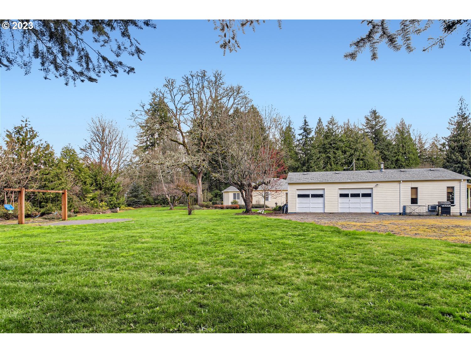 5585 Southwest River Road Hillsboro, OR 97123 - Photo 28 of 29 a view of a house with a yard
