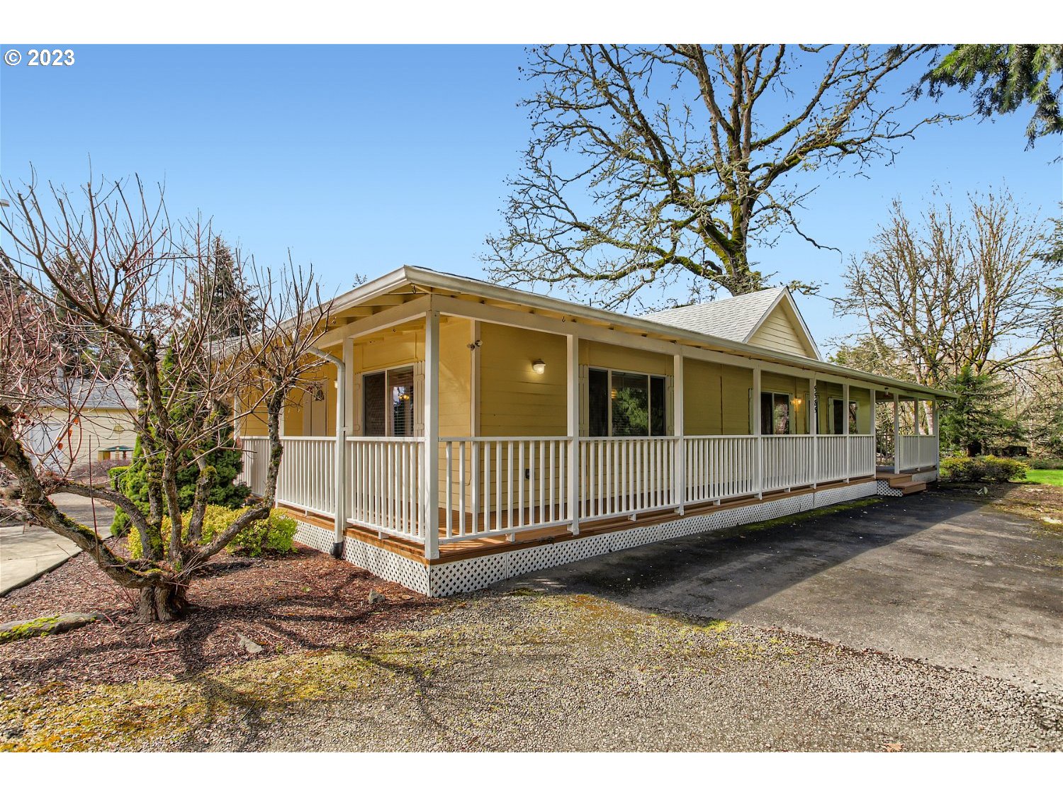 5585 Southwest River Road Hillsboro, OR 97123 - Photo 6 of 29 a front view of a house with a yard