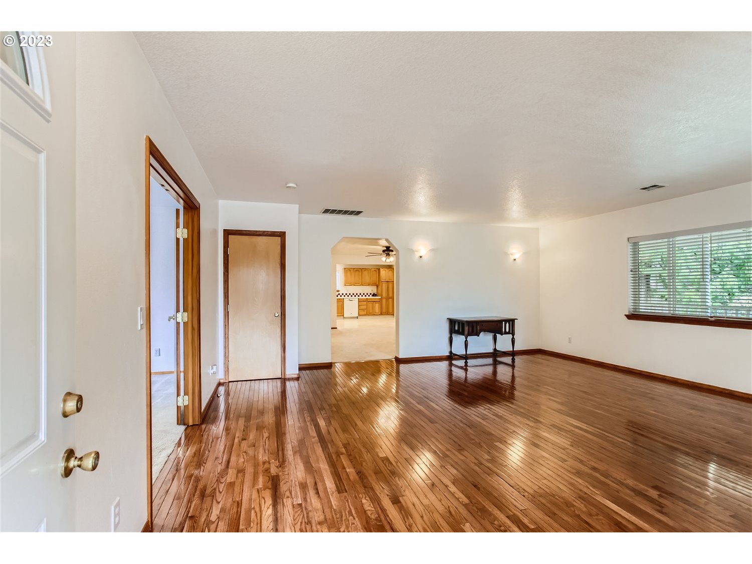 5585 Southwest River Road Hillsboro, OR 97123 - Photo 7 of 29 a view of an empty room with window and wooden floor