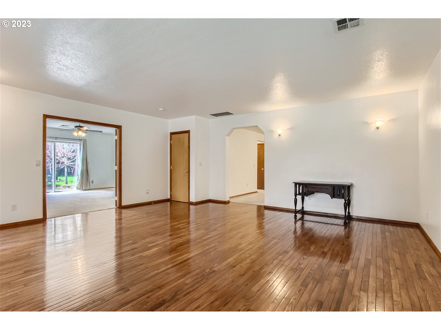 5585 Southwest River Road Hillsboro, OR 97123 - Photo 10 of 29 a view of empty room with wooden floor and fan