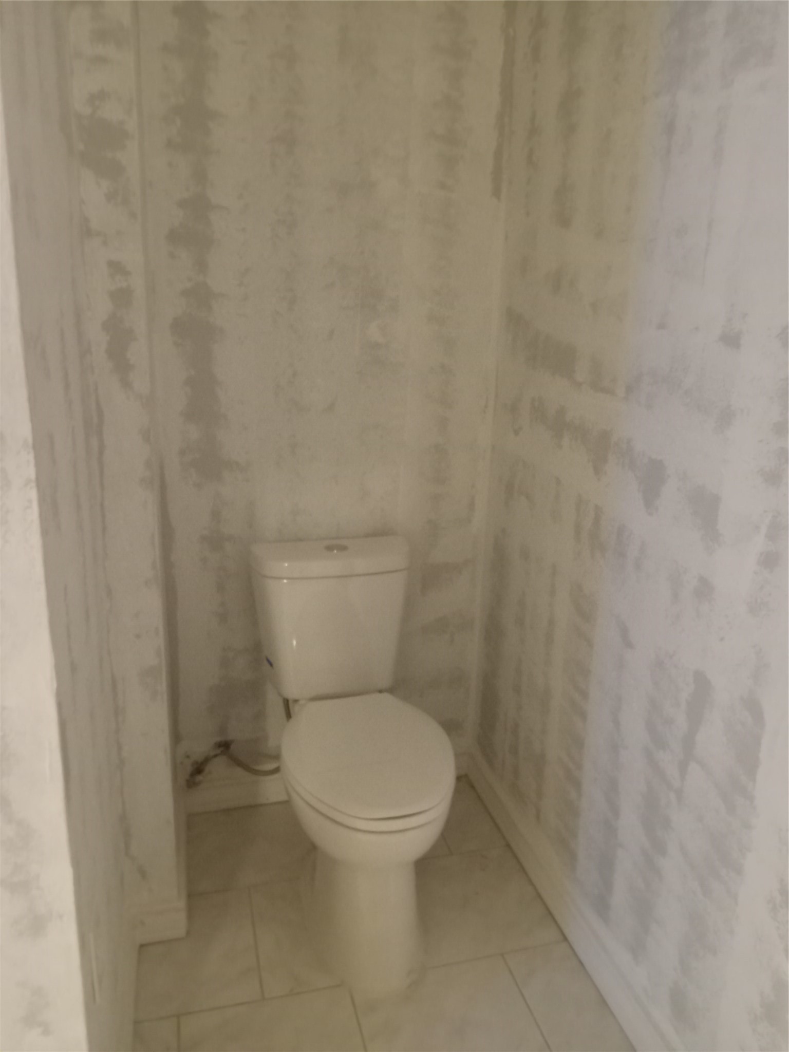 15910 Hartman Road Magnolia, TX 77355 - Photo 11 of 25 a white toilet sitting next to a shower curtain