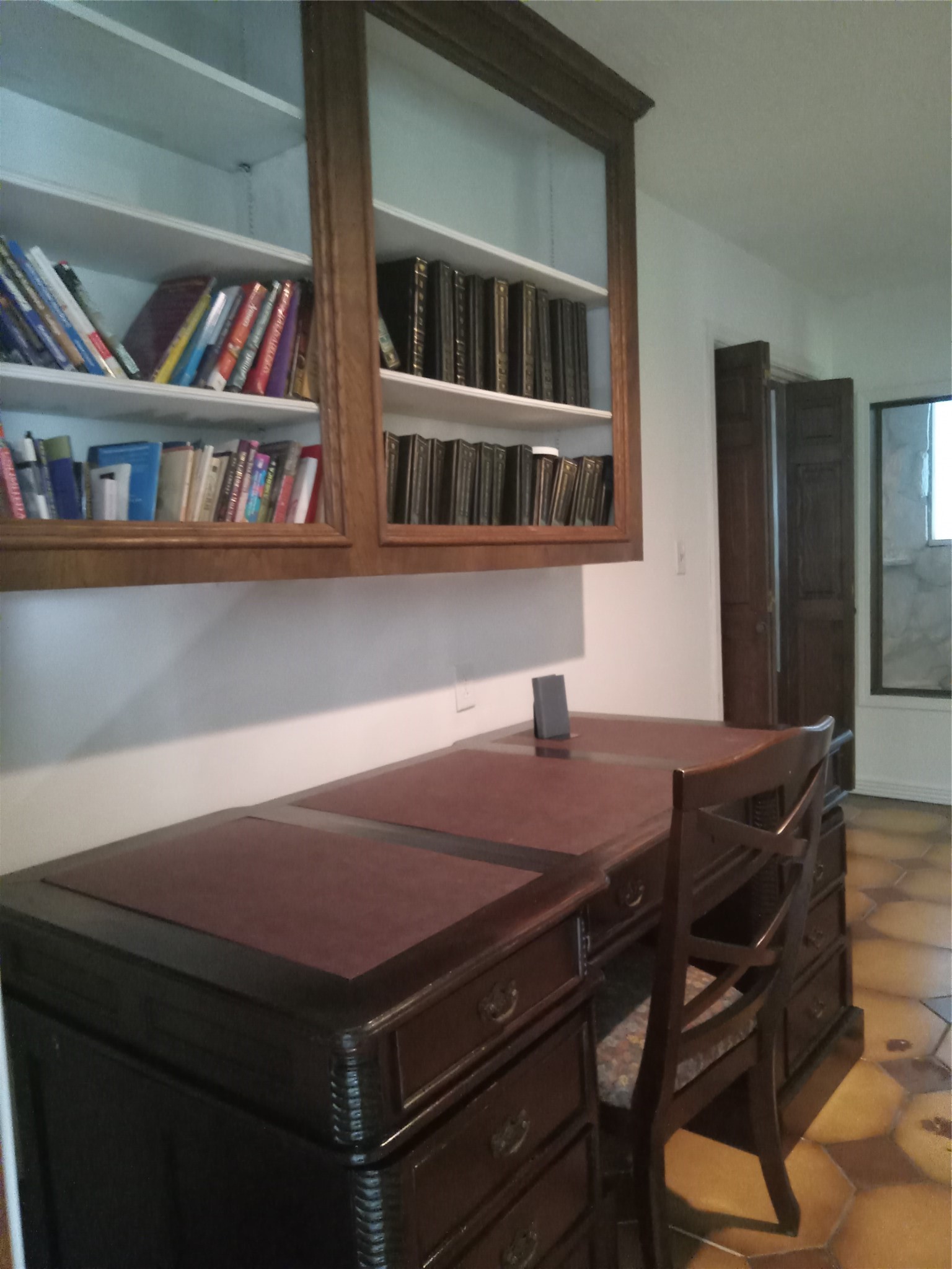 15910 Hartman Road Magnolia, TX 77355 - Photo 16 of 25 a view of a dining room with furniture and a book shelf