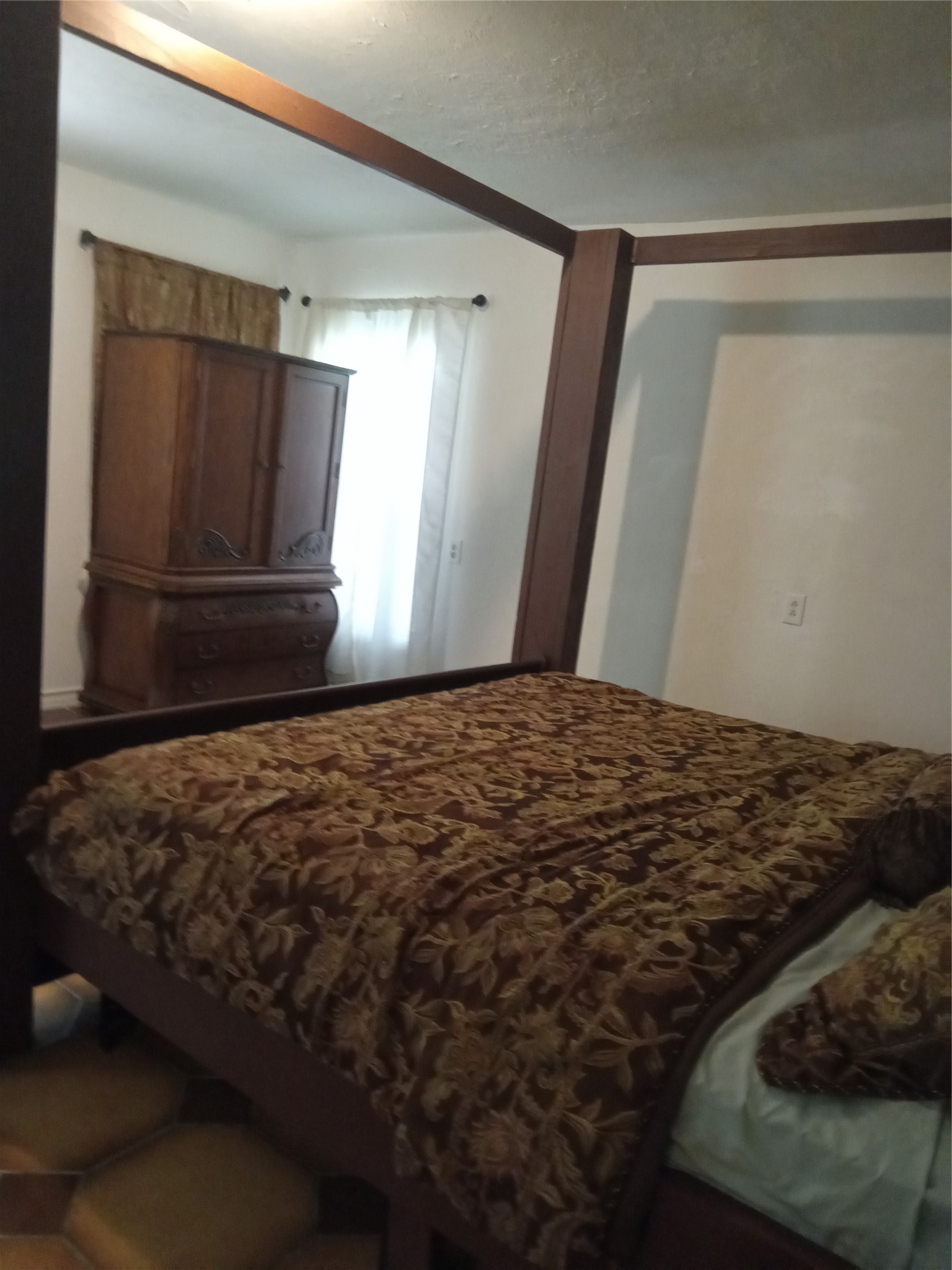 15910 Hartman Road Magnolia, TX 77355 - Photo 17 of 25 a bedroom with a bed and a window