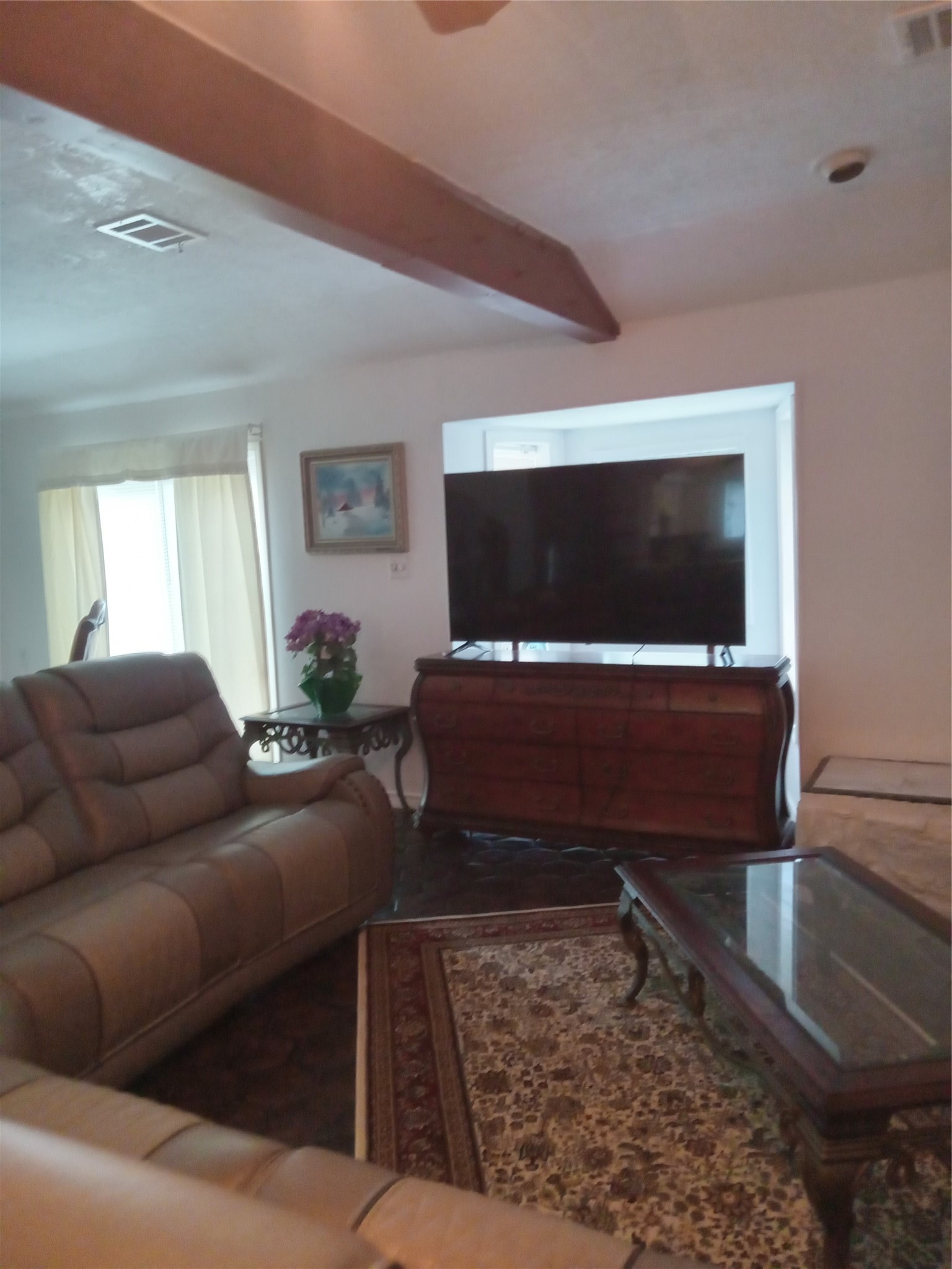 15910 Hartman Road Magnolia, TX 77355 - Photo 23 of 25 a living room with furniture and a flat screen tv