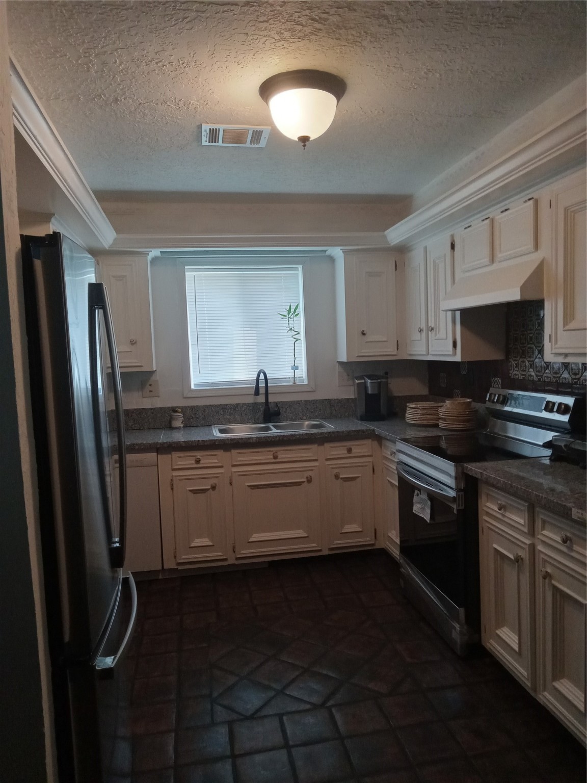 15910 Hartman Road Magnolia, TX 77355 - Photo 25 of 25 a kitchen with granite countertop a sink stainless steel appliances and cabinets