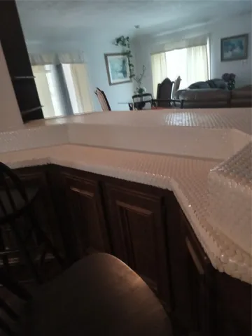 a kitchen with a sink and cabinets