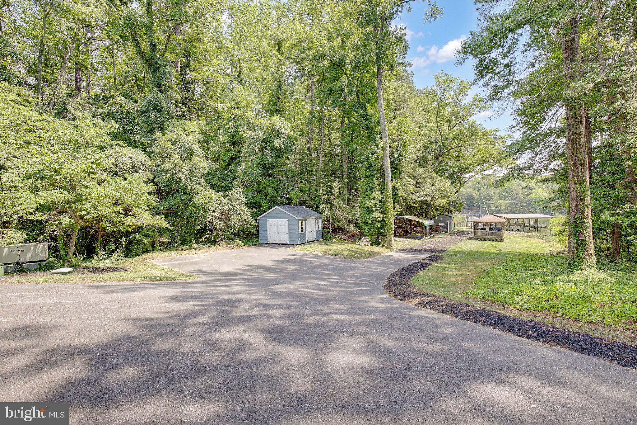 980 Apple Lane Solomons, MD 20629 - Photo 62 of 82 Serene retreat amidst lush greenery.