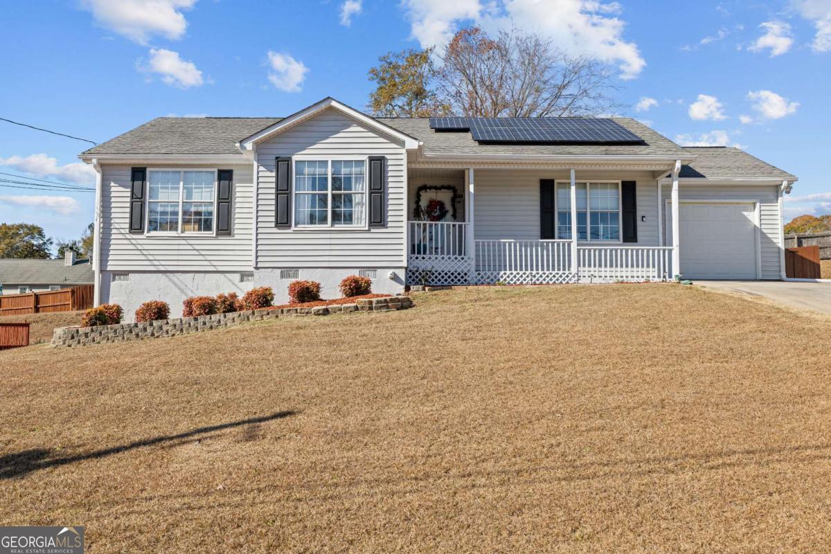 6324 Amberly Road Rex, GA 30273 - Photo 1 of 22 a front view of a house with a yard