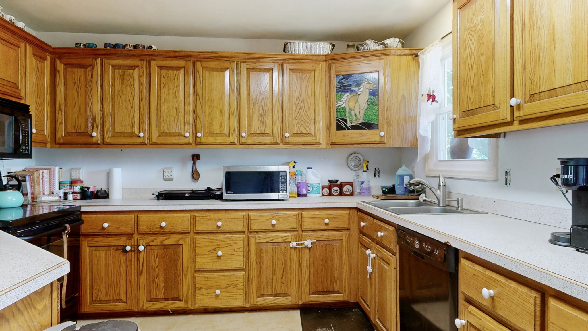 881 Coaling Road Charlotte, TN 37036 - Photo 5 of 29 a kitchen with stainless steel appliances granite countertop a sink a stove and cabinets