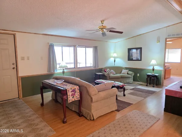 a living room with furniture and a rug
