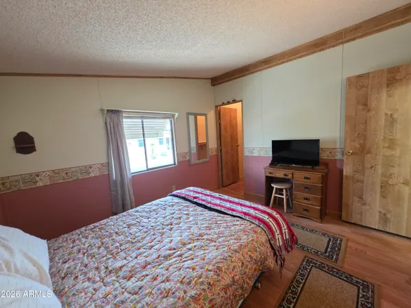 a bedroom with a bed and window