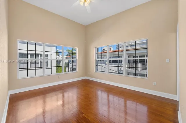 a bed room with a bed and a large window