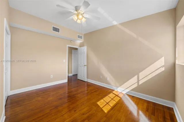 a view of room with window and ceiling fan