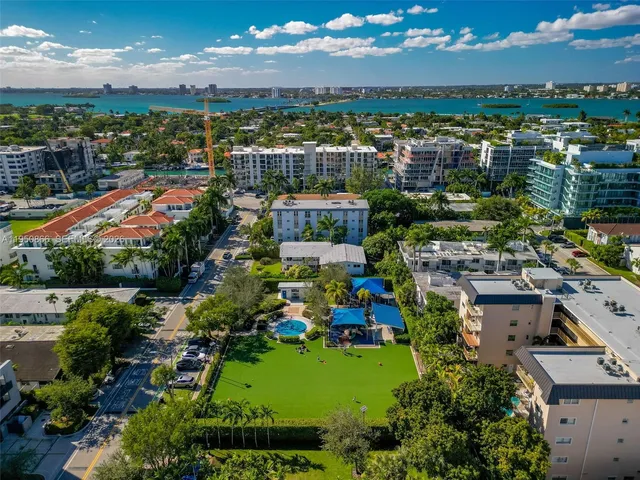 an aerial view of residential building and lake