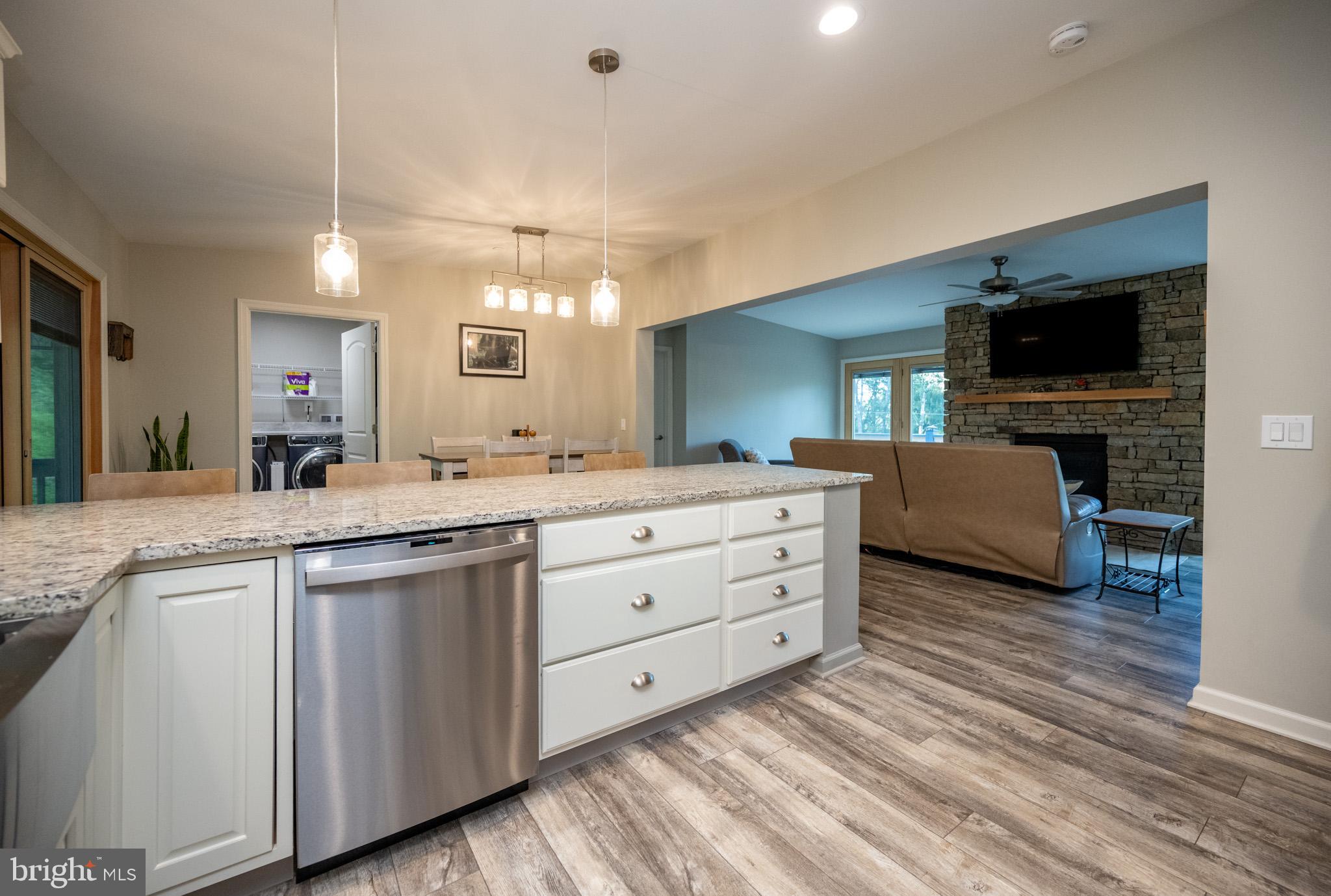 1488 Marsh Hill Road McHenry, MD 21541 - Photo 12 of 64 a spacious bathroom with a granite countertop sink and a mirror