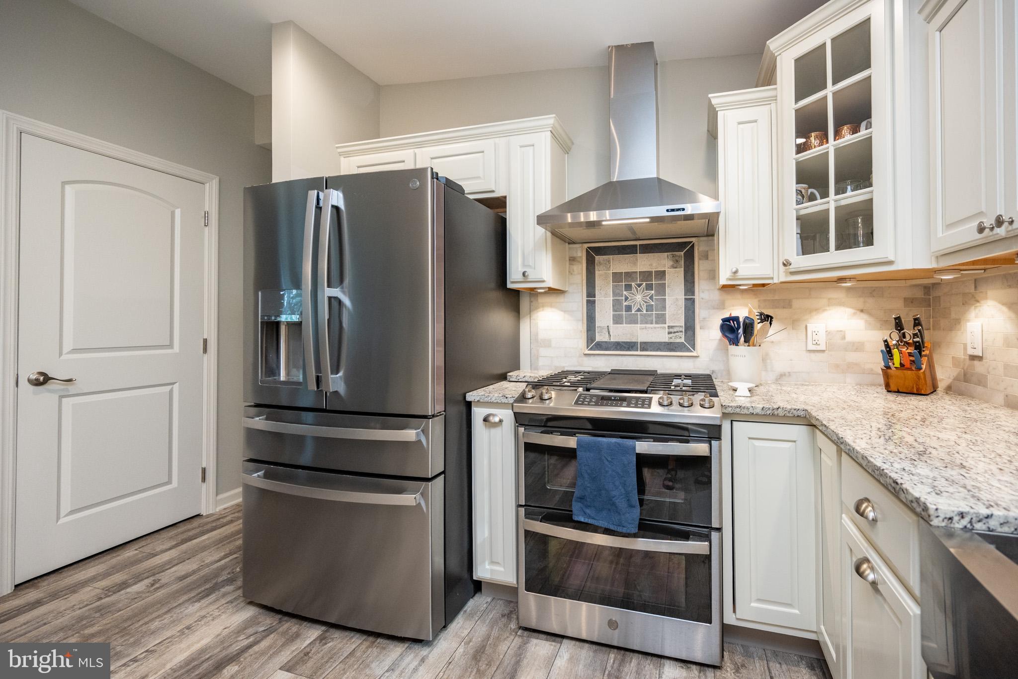 1488 Marsh Hill Road McHenry, MD 21541 - Photo 13 of 64 a kitchen with stainless steel appliances granite countertop a stove and a refrigerator