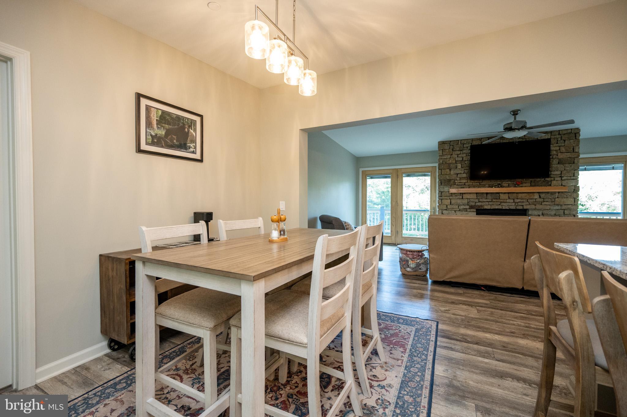 1488 Marsh Hill Road McHenry, MD 21541 - Photo 21 of 64 a view of a dining room with furniture wooden floor and a chandelier