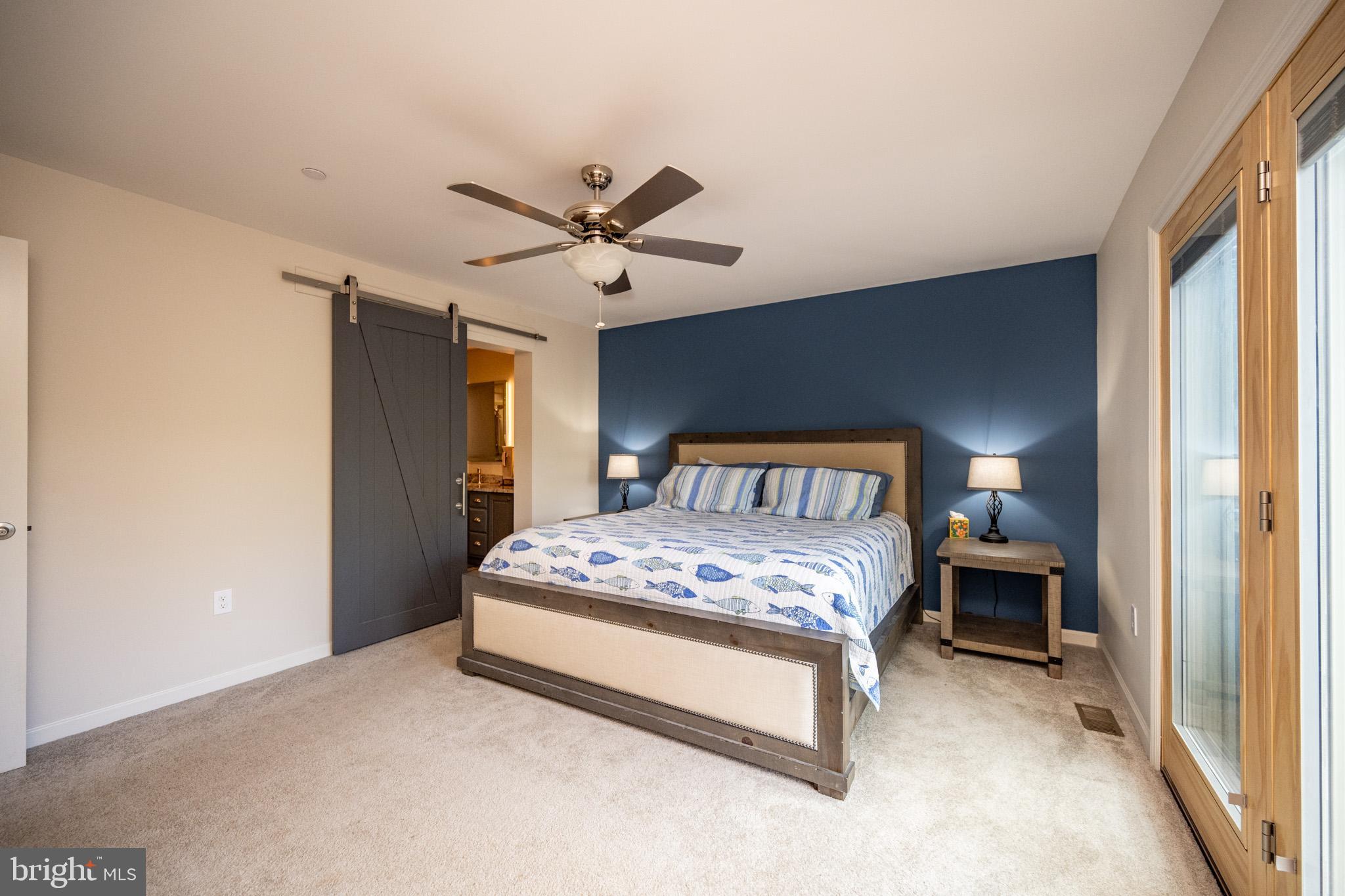 1488 Marsh Hill Road McHenry, MD 21541 - Photo 24 of 64 a bedroom with a bed and a chandelier