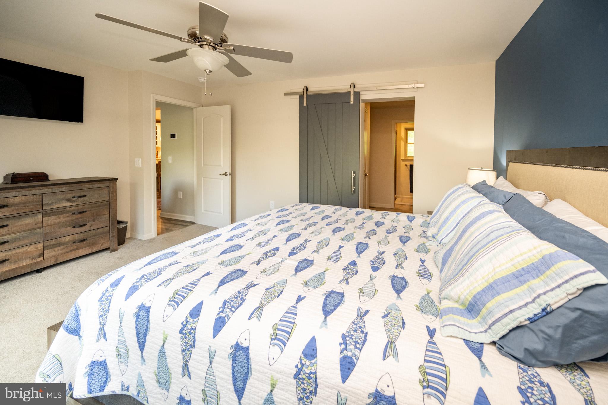 1488 Marsh Hill Road McHenry, MD 21541 - Photo 25 of 64 a bedroom with a bed and a flat screen tv